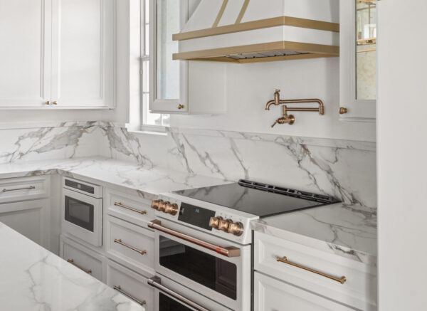 Solid slab quartz backsplash in Baldwin Park Kitchen Remodel by KBF Design Gallery
