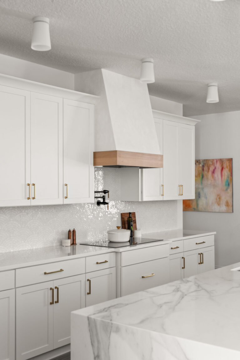 Winter Garden interior design and remodel &mdash; the kitchen's plaster hood with a white-oak band over a mother-of-pearl fan-tile backsplash and marble waterfall island