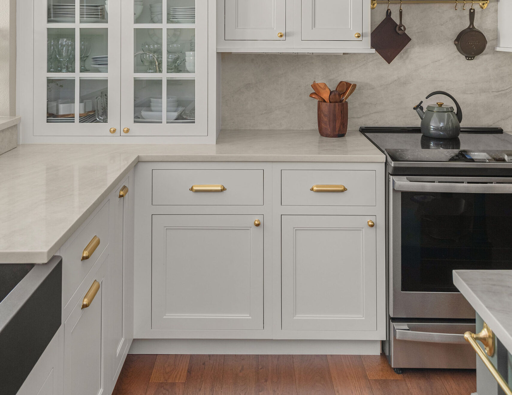 Warm cabinetry in kitchen's perimeter