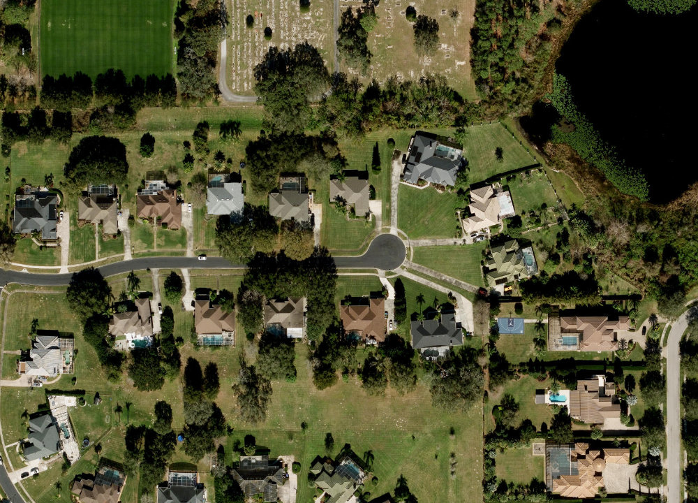 Aerial view of Magnolia Park community in Windermere, Florida &mdash; a gated lakefront enclave where KBF's full-home renovation helped set the community price record at $1,465,000.