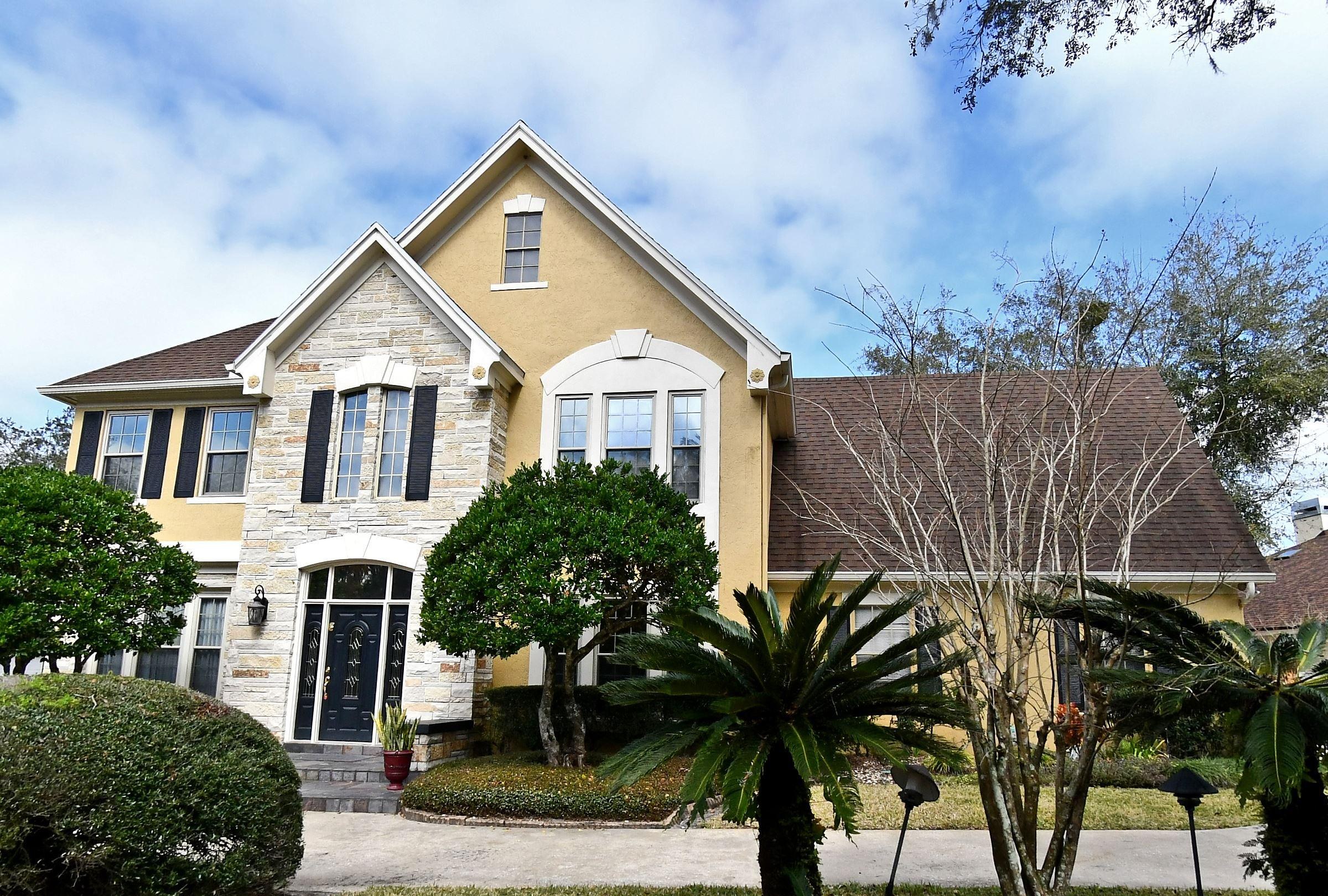 Exterior of the Nancy Circle home in Winter Springs, Florida &mdash; an interior remodel by KBF Design Gallery helped this property sell for $841,000, a street price record.