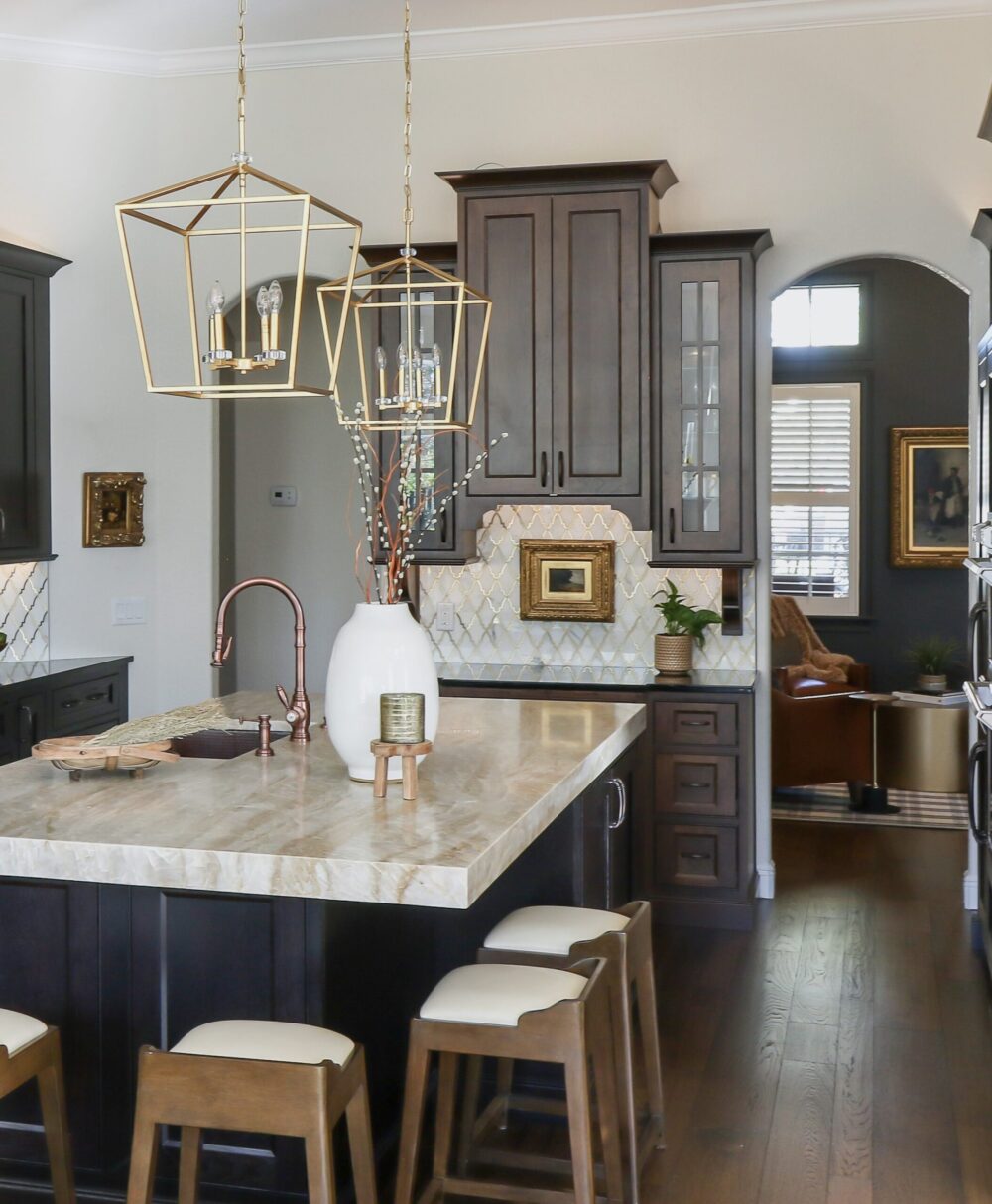 Character-rich kitchen remodel by KBF Design Gallery with built-in hutch, arched doorways, and warm custom cabinetry