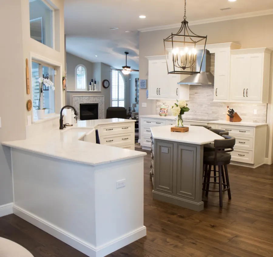 The later kitchen remodel &mdash; white perimeter, gray island under a lantern pendant
