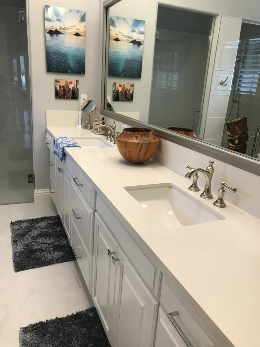 The double vanity &mdash; white quartz, polished nickel widespread faucets