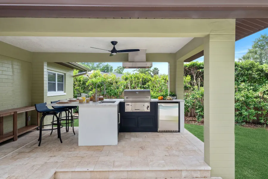 The summer kitchen with grill and bar seating