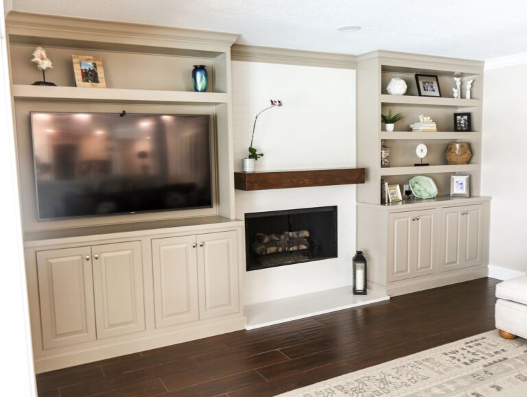 The Winter Garden fireplace wall &mdash; custom painted built-ins and a stained wood mantel, photographed on completion